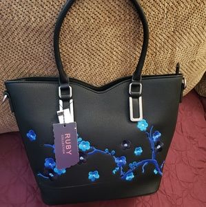 Black floral design handbag
